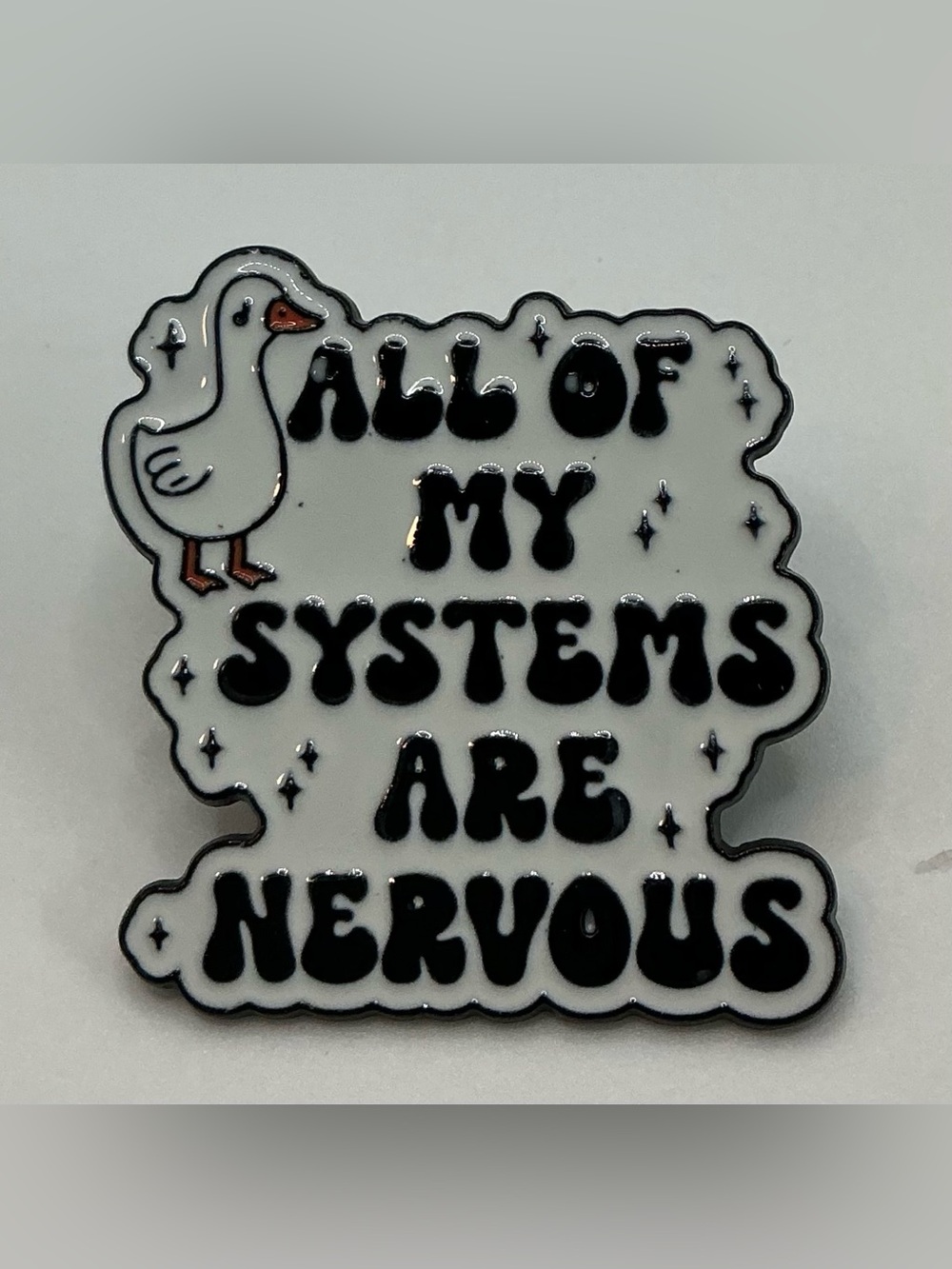 ENAMEL LAPEL PIN WHITE GOOSE ALL OF MY SYSTEMS ARE NERVOUS